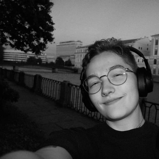 Sasha Dubovik outdoors wearing headphones